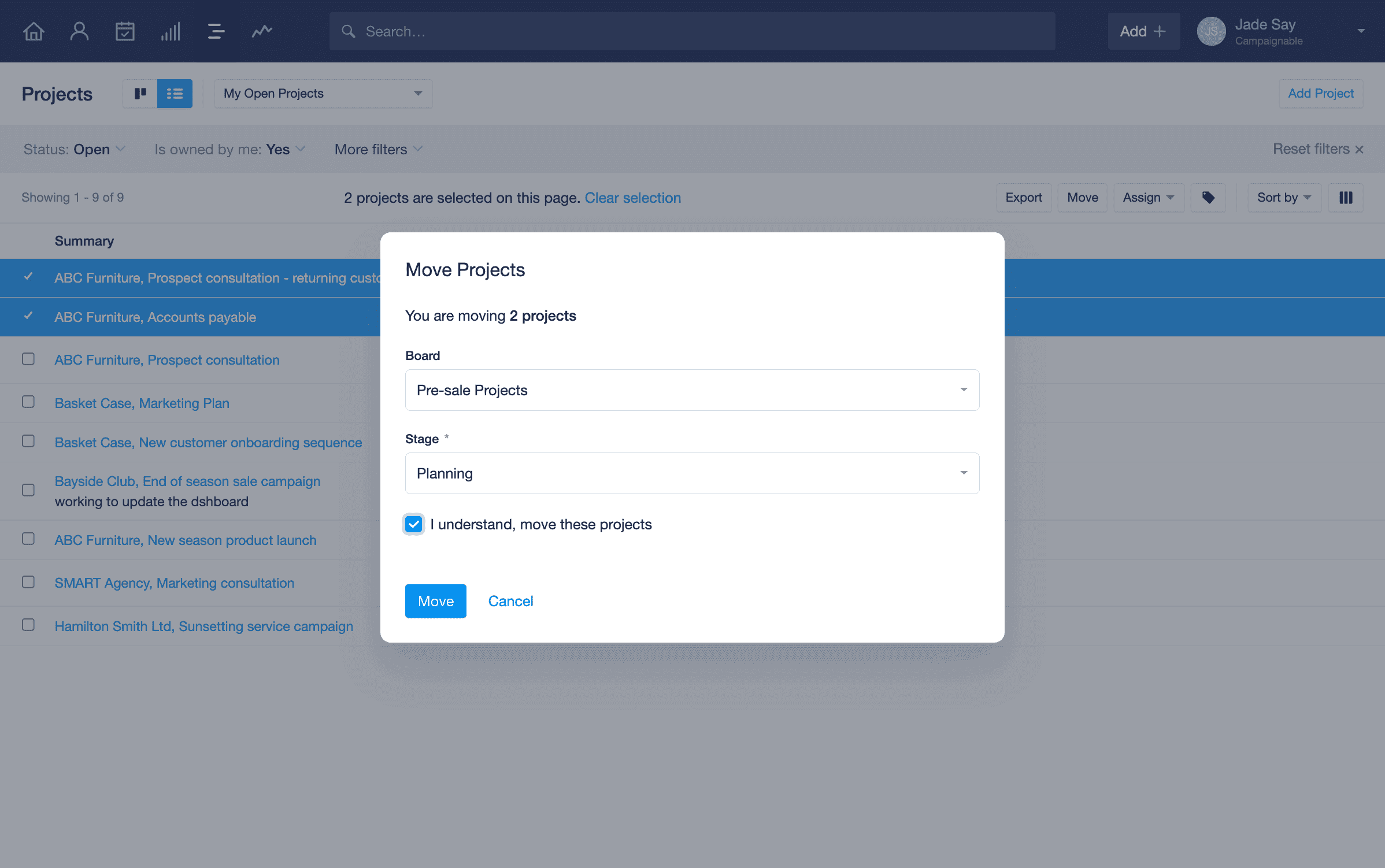 two projects are selected in the list view and the move button has been selected. A modal is displayed where the user can select the board and stage they would like to move the projects over to