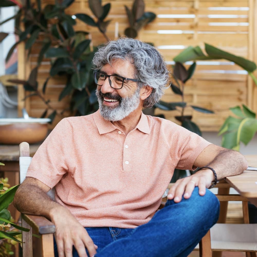 Professional sitting in chair smiling