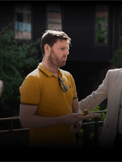 Two directors of Hyperact sitting together looking at the camera.