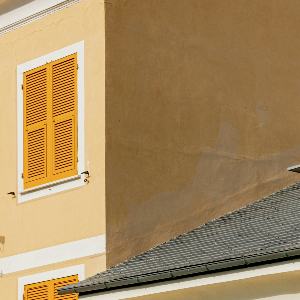 Corner of a tan-coloured house