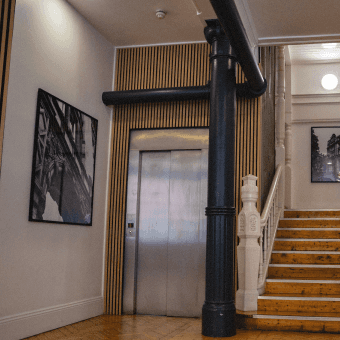 a Capsule team member working from a couch in the office.