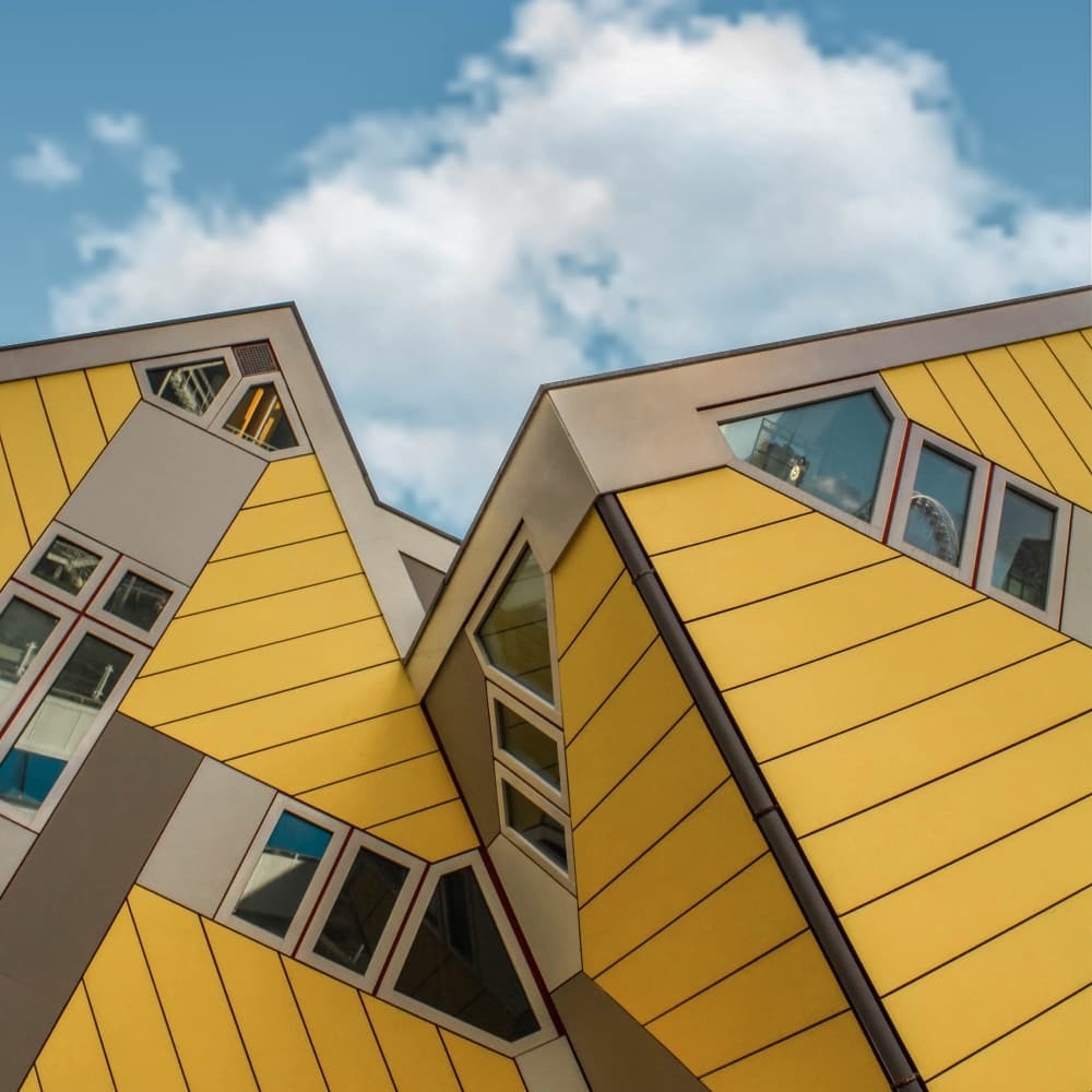 Interesting yellow buildings that appear to be leaning to one side